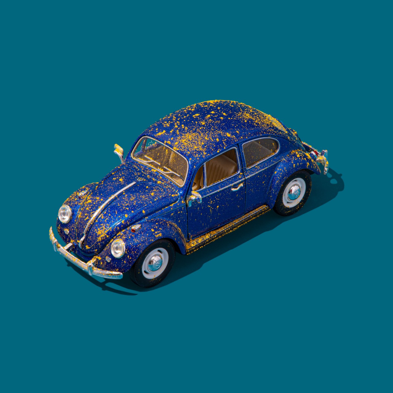 Yellow Pollen Covers Blue Model Car