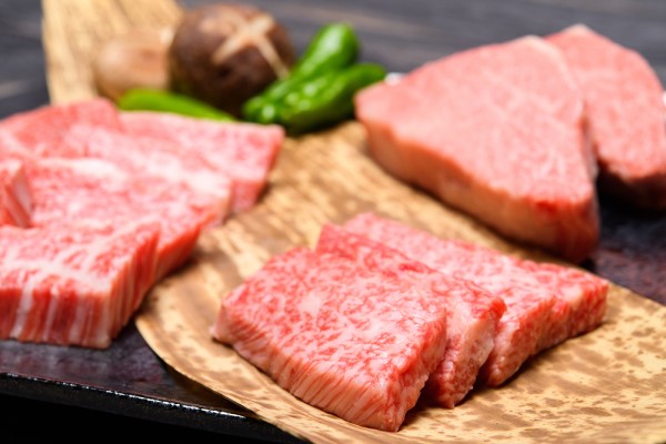 Cut slices of raw beef on a plate