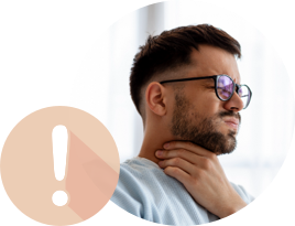 A man holding his neck while squinting in pain