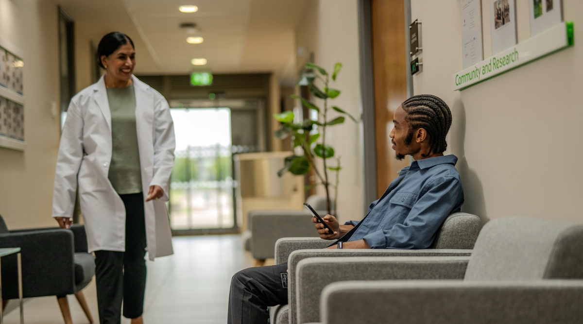 healthcare provider greeting patient