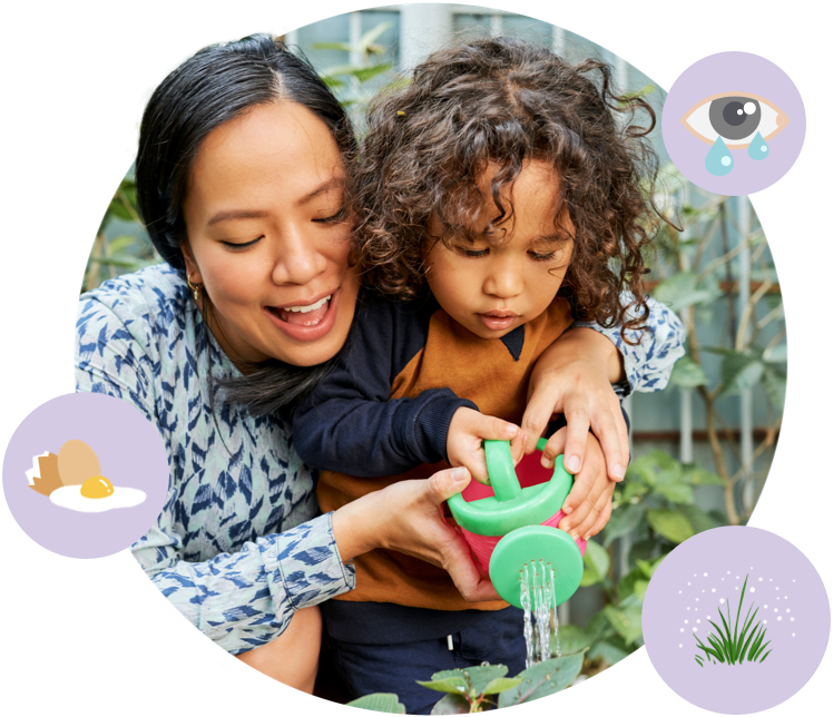 mom and son watering plants during allergy season