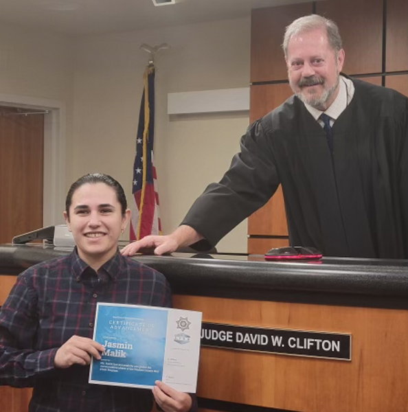 Jasmin Malik shown graduating from the STAR program.