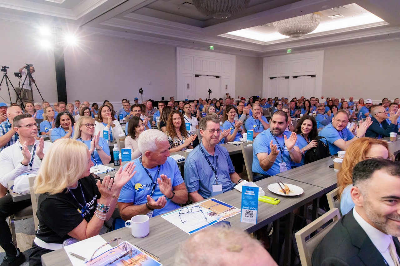 The 450 ALK-positive cancer patients and their care partners who attended the patient summit in San Diego show their support and gratitude for the advocacy of Colin Barton (center).